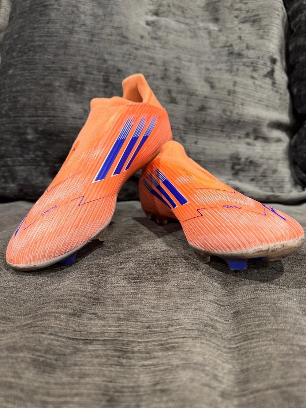 adidas Laceless Soccer Cleats in Neon Orange with Blue Accents
